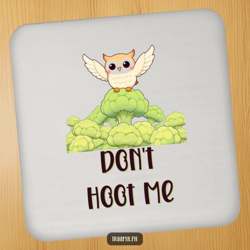 Funny owl character flying over a broccoli forest on a protective drink coaster, a humorous home accessory.