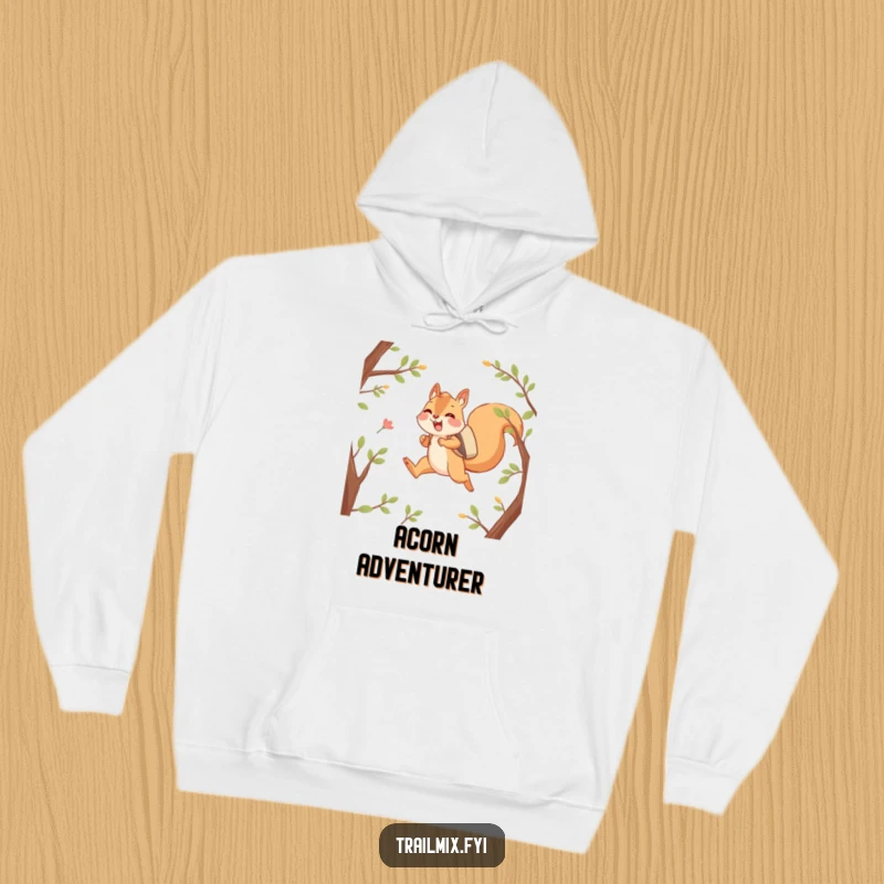 Funny hoodie featuring a happy squirrel character joyfully leaping between branches with a backpack, radiating cozy, adventurous vibes.