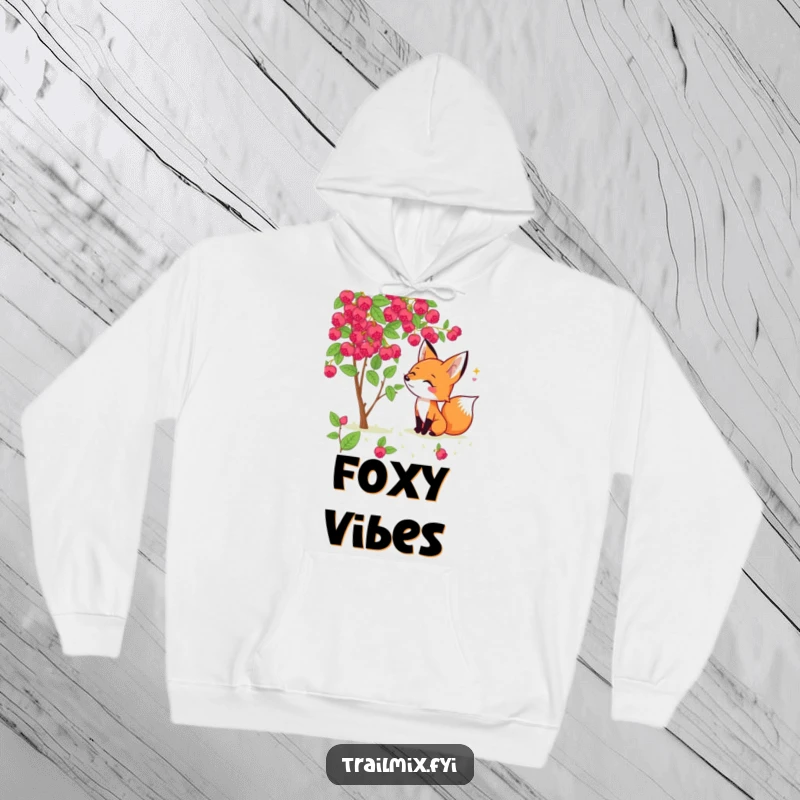 Funny fox hoodie featuring a cheerful fox with its nose deep in a wild berry bush, a cozy scene of delight.