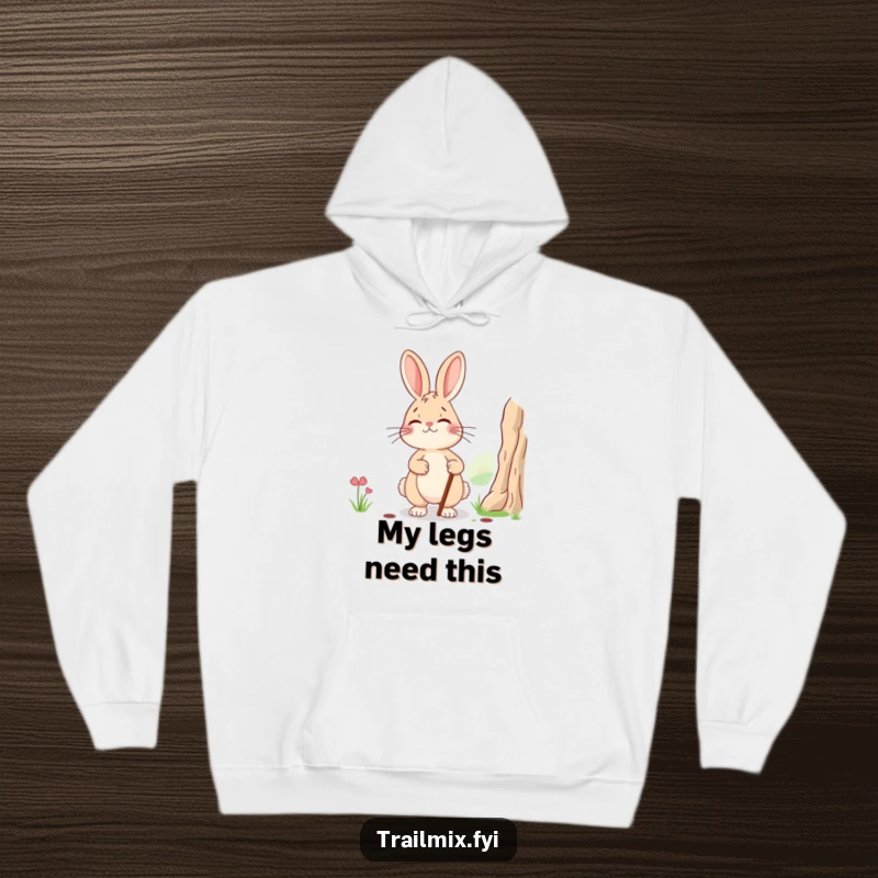 Funny hoodie: a smiling, tired rabbit with a walking stick pausing to admire a landscape view, offering cozy and humorous comfort.
