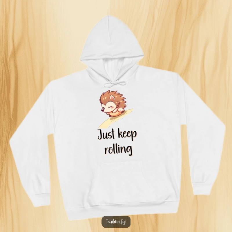 Funny hedgehog hoodie depicting a determined character in a comical ball-roll down a slope, emphasizing fun and a carefree attitude.