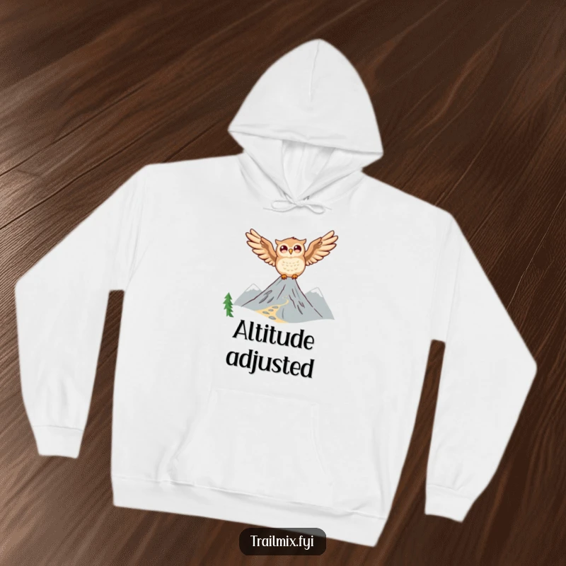 Funny Owl Hoodie: A joyful owl glides through the air above a majestic mountain trail, perfect for cozying up.