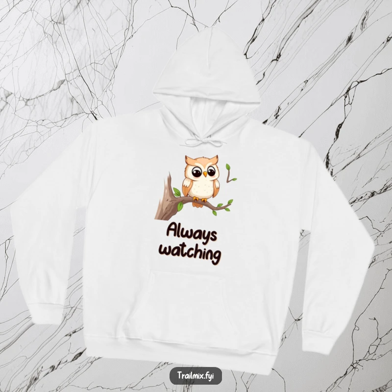 Funny hoodie featuring a smiling owl watching the trail from a branch, providing warmth and a touch of intellectual humor.