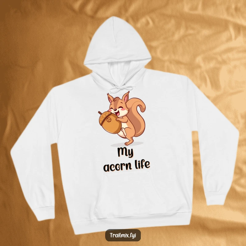 Funny happy squirrel gleefully hiking up a giant acorn, depicted on a soft, warm hoodie.